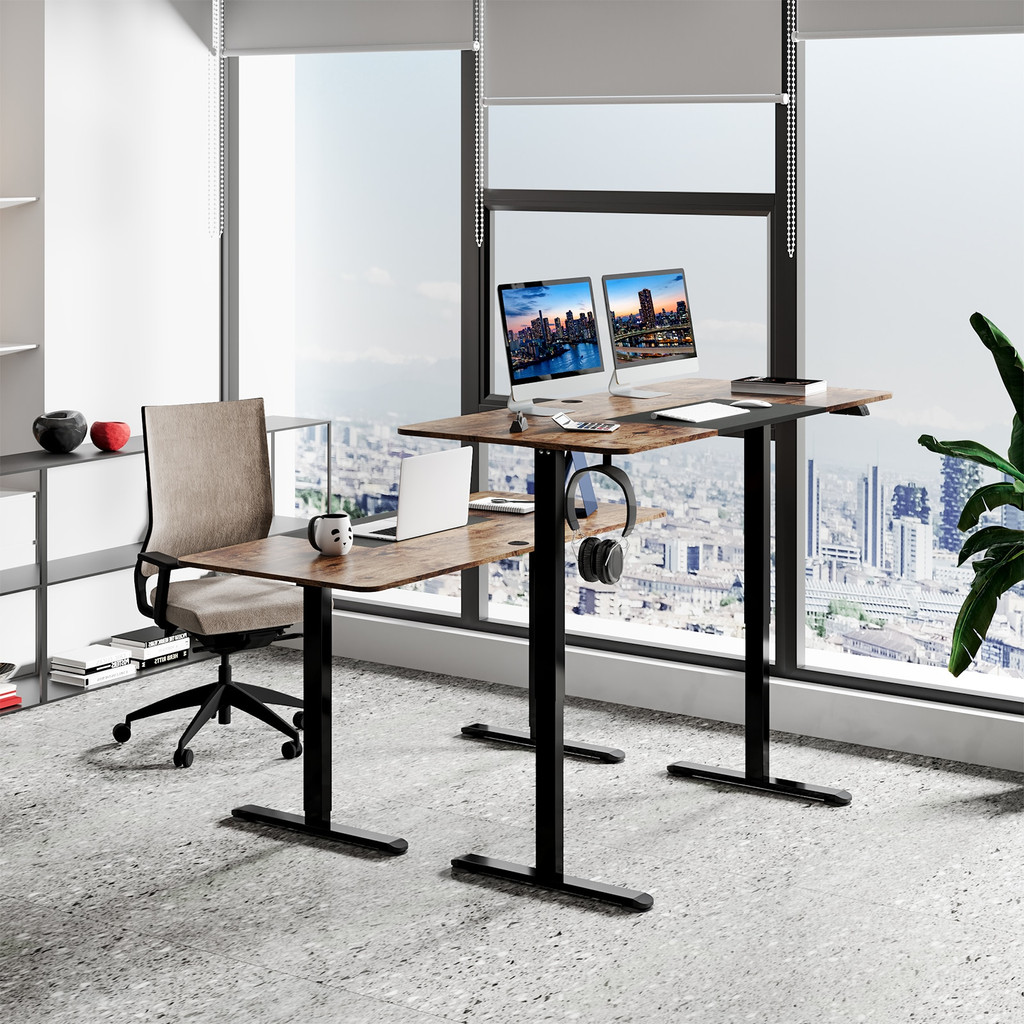 Two desks in an office space with a city view and chairs